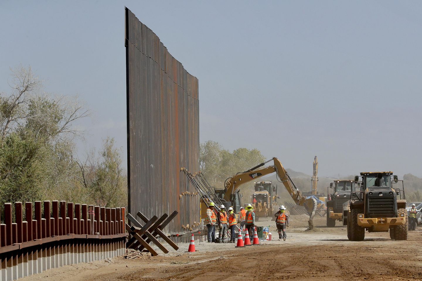 Biden administration says it's done selling off border wall materials — for now