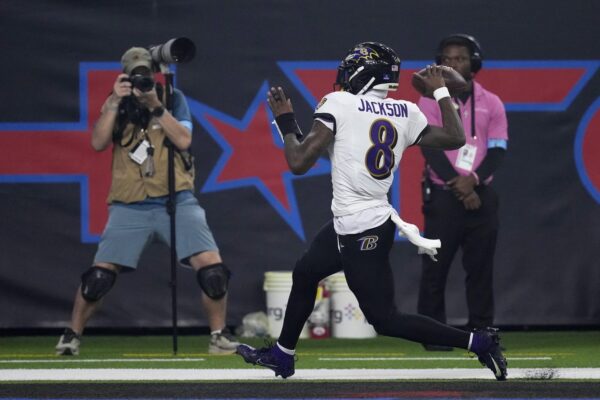 Jackson breaks NFL quarterback rushing record, accounts for 3 TDs as Ravens rout Texans